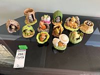 Group shot of all twelve Woodland Surprises figurines on tabletop