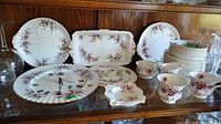 Full assortment of Royal Albert Lavender Rose pieces on shelf