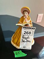 Front view of Royal Doulton HN5171 figurine with auction tag