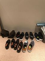 All pairs lined against wall showing variety