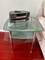 Front/top view showing glass top, bubble texture, and chrome legs