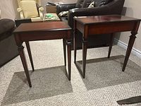 Two nesting tables side by side showing size difference