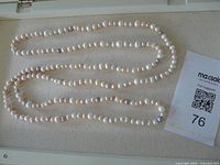 Full view of continuous freshwater pearl strand laid out