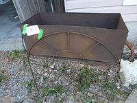 Overall view of assembled rusted metal plant stand