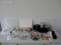 Entire lot on dresser showing organizer, thread cones, button containers and Velcro
