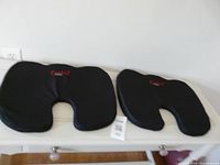 Both gel seat cushions on surface