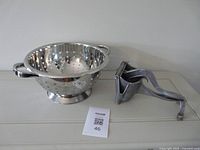 Colander and juicer side by side showing overall condition