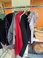 Garments hanging on rack showing variety of pieces