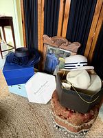 Group of four hats with three visible boxes