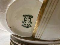 Underglaze green backstamp on saucer underside showing maker