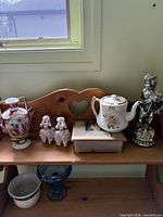 Overall view of items on wooden shelf