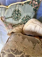 Topiary tapestry pillow, partial view of others