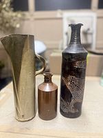 Group shot of all three pottery pieces standing side by side