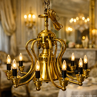 Full view of brass chandelier illuminated