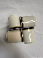 Four espresso cups showing glaze pattern