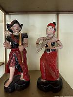 Front view of both porcelain dancer figurines
