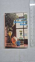 Front cover of the book titled Collectible Glass by Albert Christian Revi with photo of various collectible glass pieces.