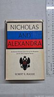 Front cover of the book 'Nicholas and Alexandra' by Robert K. Massie with ruler for scale.