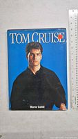 Front cover of the book showing Tom Cruise against a blue background with white and red text for the title and author.