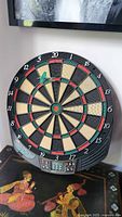 Full view of the electronic dart board showing numbered sections, dart placement, and general layout.