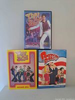 Front view of DVD box sets: That 70's Show Seasons 1 and 2, American Dad Volume One.