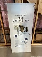 Photo of boxed commercial grade dual garment rack featuring branding and product image on front.