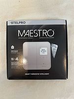 Front of Stelpro Maestro thermostat box showing product image and name.