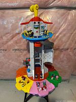 Full front view of PAW Patrol My Size Lookout Tower with multiple character figures around the base and top.