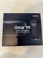 Front view of the sealed box of Samsung Gear VR with Controller, showing branding and product image.