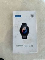 Outer box front showing Da Fit Business Sport Smart Watch image with 1.32-inch 360x360 HD screen text.