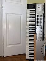 Full top-down view of the Novation 61SL MkII MIDI Keyboard Controller showing all 61 keys and the control interface on the right side.