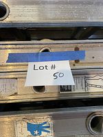 Close view of ladder rails with lot tag