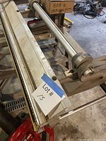 End view of brake showing clamp assembly and yellow hinge strip