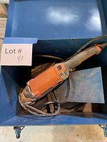 Grinder, cord and case overall view