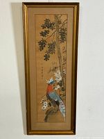 Full view of the framed Chinese watercolour painting showing bird perched on branch with foliage and flowers, with signature in Chinese writing.