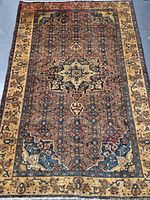 Full view of the Persian handmade wool rug showing entire pattern, colors, and condition.