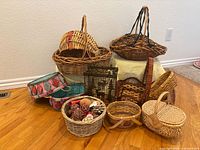 Group of assorted baskets showing wicker, fabric and wire types