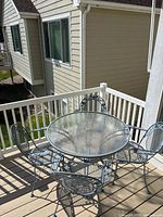 table with four chairs on deck