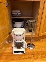 All five items inside and in front of cabinet