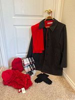 Overall lot with coat, scarves, hats and gloves displayed