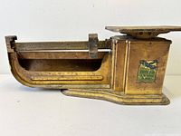 Left side view showing Triner scale, mail cradle, patinated finish, brand decal