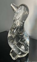 full side view of clear glass penguin figurine