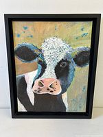 Full view of framed cow painting