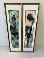 Front view showing both framed abstract floral watercolour paintings