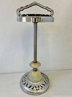 Full view of standing ashtray showing handle, column and base