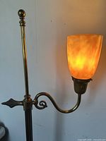 Upper pole, swing arm and illuminated shade showing working condition and brass details