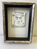 Frontal view of framed portrait