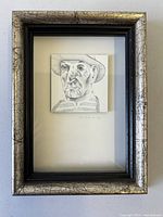 Front view of framed miniature portrait showing image, mat, and frame