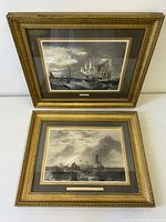 Both framed engravings stacked vertically showing fronts