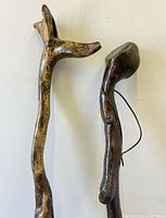 Top sections showing forked handle and club head